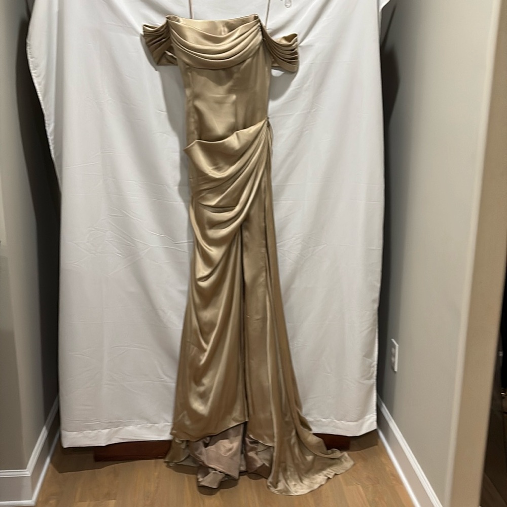 Beautiful gold champagne evening gown with high leg slit.